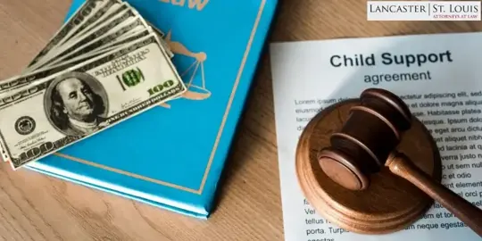 money on a law book.